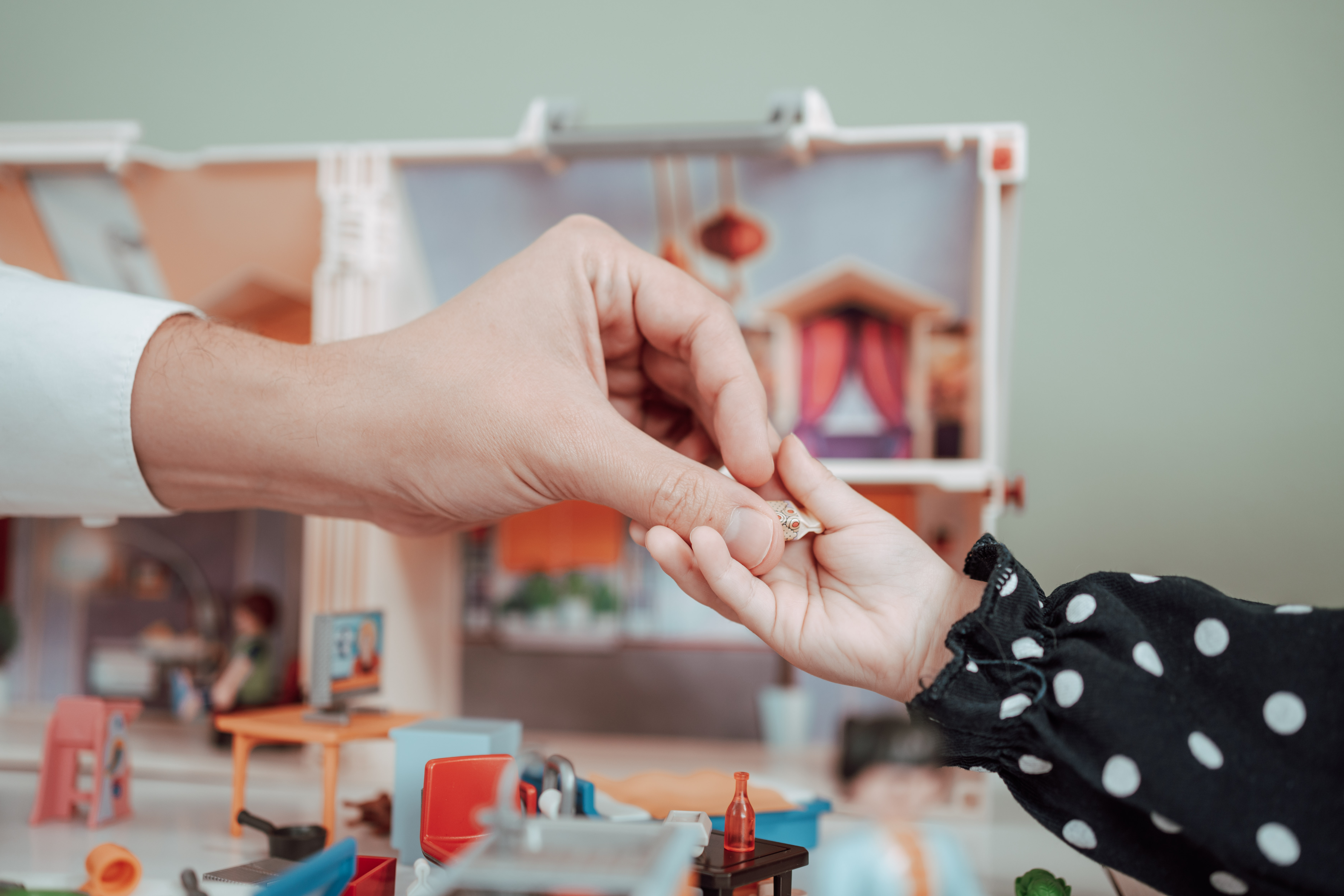 Child and adult playing
